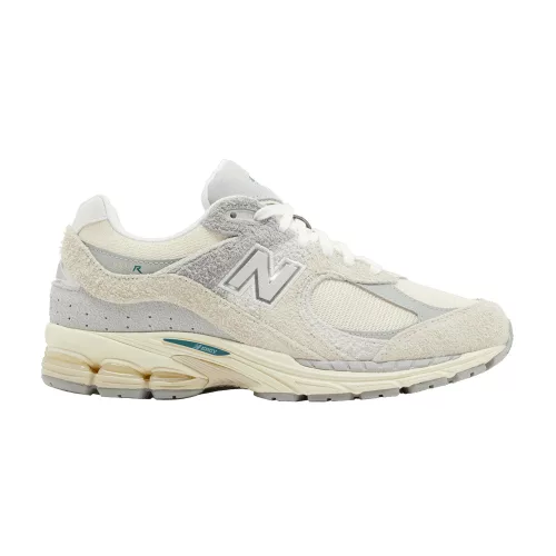 New Balance 2002R Linen nízke streetové tenisky béžové-sivé — produktová fotografia na bielom pozadí, bočný pohľad